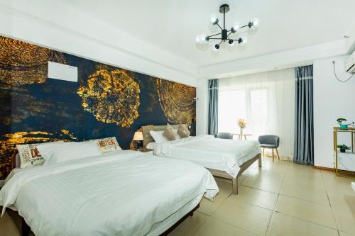 Postel nebo postele na pokoji v ubytování Dalian Hong Xi Yuan Apartment Wanda Plaza
