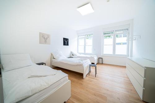 En eller flere senge i et værelse på DQ01 - Monteurwohnung - WLAN - 5 Personen