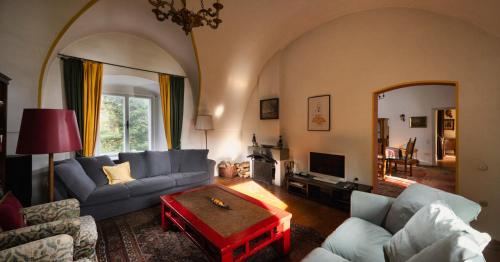 a living room with a couch and a table at Landhaus im Waldviertel in Zwettl Stadt