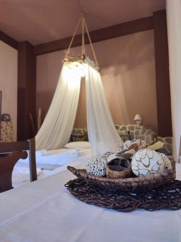 a basket of items on a table in a bedroom at Maria's Paradise in Vonitsa