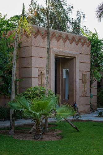 Κήπος έξω από το Villa Al Assala Palmeraie