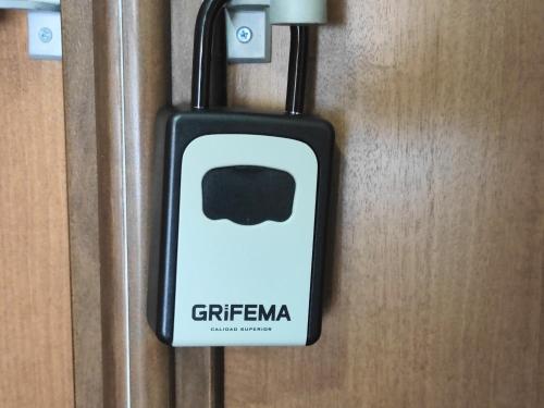 a s cell phone is hanging on a door at il Rifugio del Marinaio in Genova