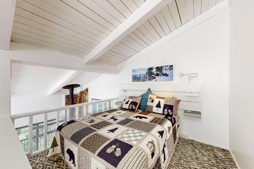 a bedroom with a bed on a balcony at Sunrise Serenity at Tahoe Village in Stateline