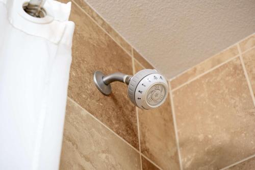 a shower knob on a tiled wall at Hampton Inn Elkhorn Lake Geneva Area in Elkhorn