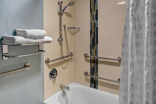 a bathroom with a sink and a shower at Hyatt Place Nashville Opryland in Nashville