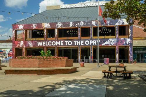 a building with a sign that reads welcome to the open at Hyatt Place Nashville Opryland in Nashville