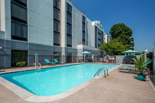 a large swimming pool in front of a building at Hyatt Place Nashville Opryland in Nashville