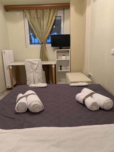 Ένα ή περισσότερα κρεβάτια σε δωμάτιο στο Elegant Escapes 3