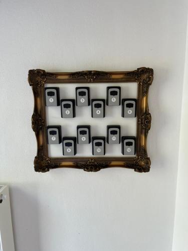 a picture frame on a wall with a calculator at Moseltürmchen Cochem in Cochem