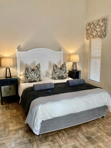 Ένα ή περισσότερα κρεβάτια σε δωμάτιο στο The Merino Guest House