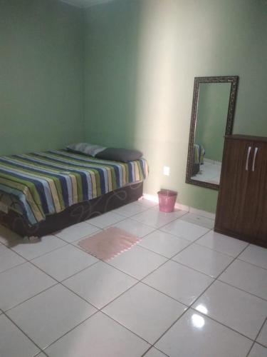 A bed or beds in a room at casa pq taruma 6 carros
