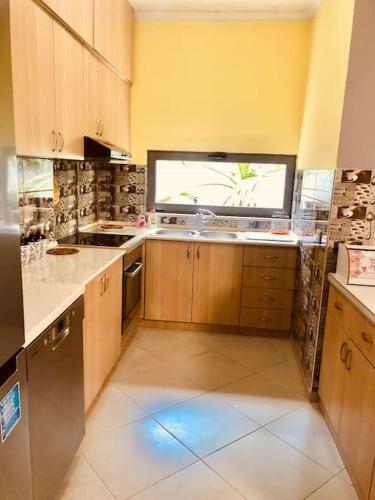 Kuchyň nebo kuchyňský kout v ubytování Orion Central Apartment