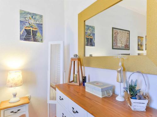 a room with a dresser with a mirror on the wall at Seaview Holiday Home GATSBY in Petrcane