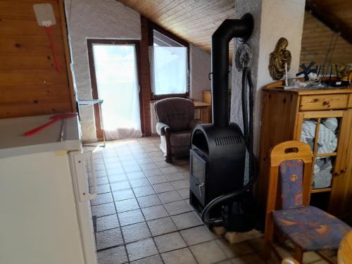 a kitchen with a stove in the middle of a room at Trochtelfingen F1 in Trochtelfingen
