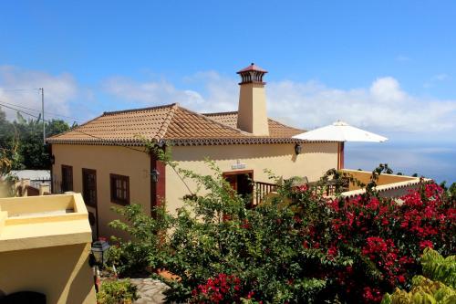 a house with a lighthouse on top of it at Los Nacientes: Marcos in Los Sauces