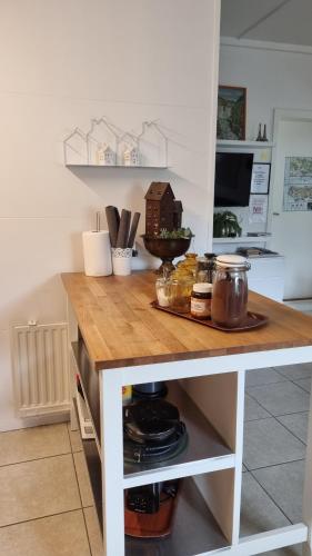 a kitchen island with a counter top in a kitchen at Guesthouse Galleri Vík in Vík