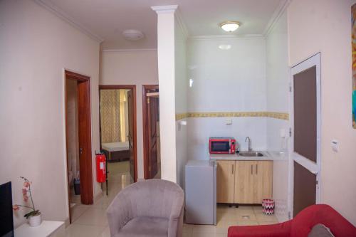 a room with a kitchen and a living room at RIVER APPARTS in Brazzaville