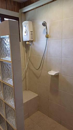 a shower in a bathroom with a shower at Uthai River Lake Resort in Ban Nong Nam Khan