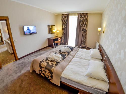 Katil atau katil-katil dalam bilik di Romantik Spa Hotel