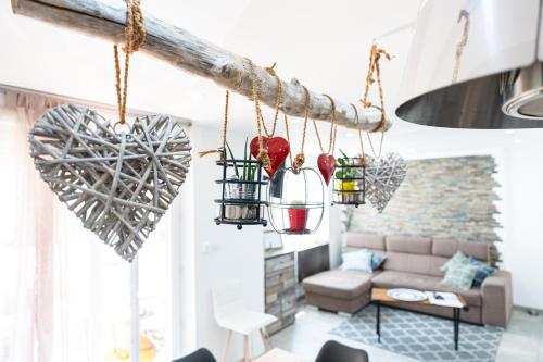 a living room with hearts hanging from the ceiling at Appartement des Sorcieres - Witches Apartment in Sélestat