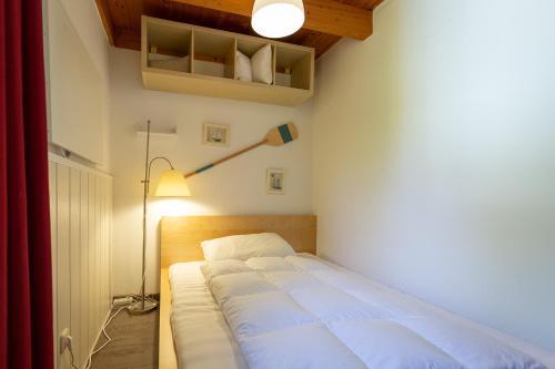 Katil atau katil-katil dalam bilik di Ferienhaus am Mönchneversdorfer See