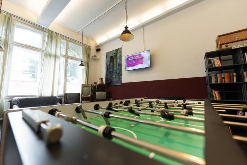 a room with a table with a pool ball at Industriepalast Berlin in Berlin