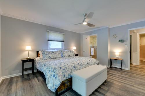 a bedroom with a bed and two tables and two lamps at Spacious Lake Norman Retreat with Private Dock! in Sherrills Ford