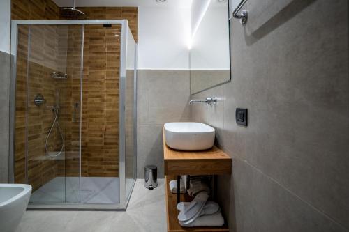 a bathroom with a sink and a shower at Virdamuri - Etna Country Resort in Giarre