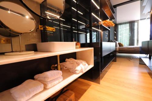 a room with a shelf with towels on it at DOURO VIEWS Luxury Design Beach Apartment in Vila Nova de Gaia
