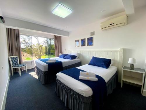 Postel nebo postele na pokoji v ubytování Hotel Renty Beach