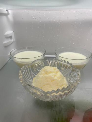 two bowls of food are sitting in a microwave at Villa Meta - Welcoming You with Byrek & Traditional Meals in Gusmar