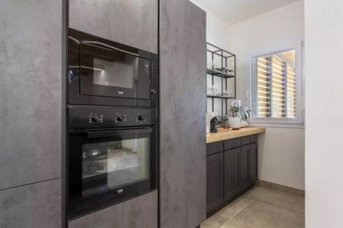 a kitchen with two ovens and a counter at Home Paradise in Marsala