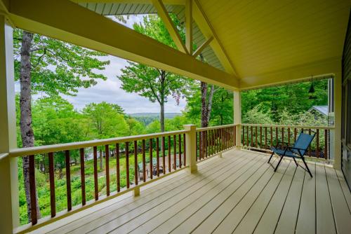 a screened in porch with a chair on it at Dragonwood Retreat 