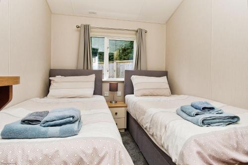 Ένα ή περισσότερα κρεβάτια σε δωμάτιο στο The Lodge