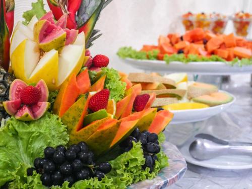 a bunch of fruits and vegetables on a table at Marbello Ariau Hotel in Fortaleza