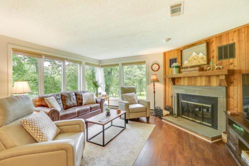 a living room with a couch and a fireplace at Wintergreen Resort Vacation Rental with Balcony! in Mount Torry Furnace