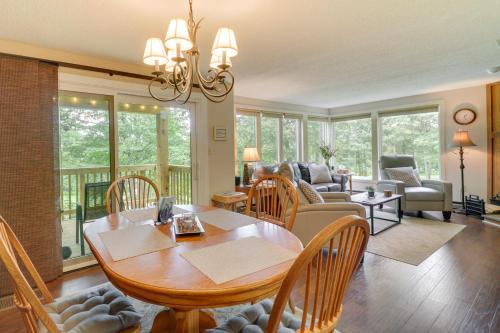 a living room with a wooden table and chairs at Wintergreen Resort Vacation Rental with Balcony! in Mount Torry Furnace