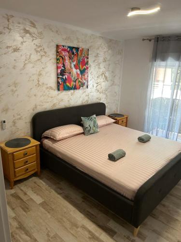a bedroom with a bed with two pillows on it at Sweet dreams in Alicante