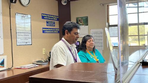 a man and a woman standing at a counter at Extended Stay Motel - Snyder in Snyder