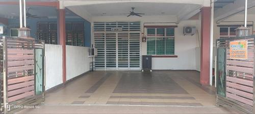 an empty arena with stalls in a building at RWA Segamat homestay in Segamat