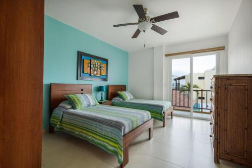 A bed or beds in a room at Beso del Sol