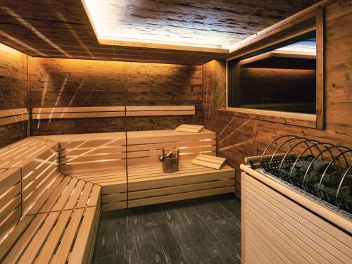 a wooden sauna with a bench and a window at Ferienresidenz Raich in Ried im Oberinntal