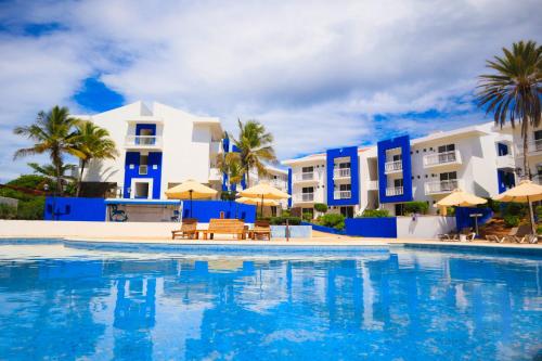 a large swimming pool in front of a building at Hesperia Playa el Agua in El Agua