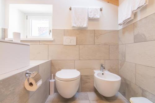 a bathroom with a toilet and a sink at R&B al lago in Domaso