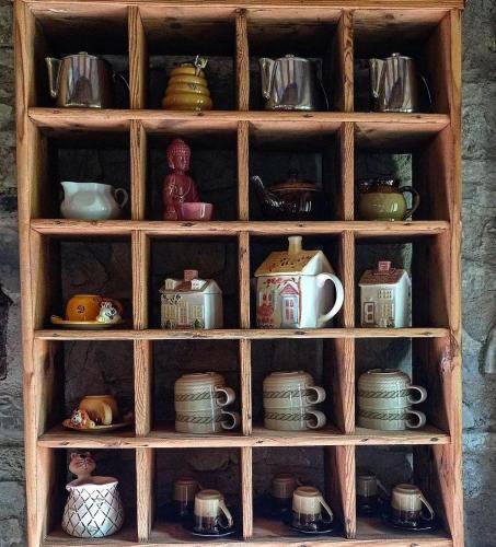 a wooden hutch filled with lots of pots and pans at Bed and Breakfast Ballallaluna in Maiolo