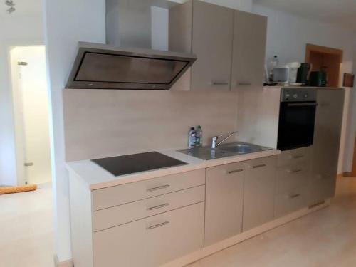 Η κουζίνα ή μικρή κουζίνα στο Quiet, modern flat with own terrace