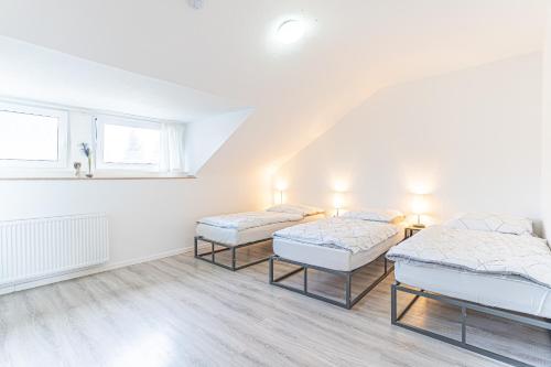 מיטה או מיטות בחדר ב-GOLDVILLA - Köln