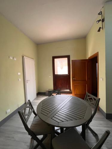 a dining room with a table and chairs at Tuscany Experience BnB in Foiano della Chiana