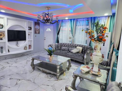a living room with a couch and a table at Rovie Estates in Buea