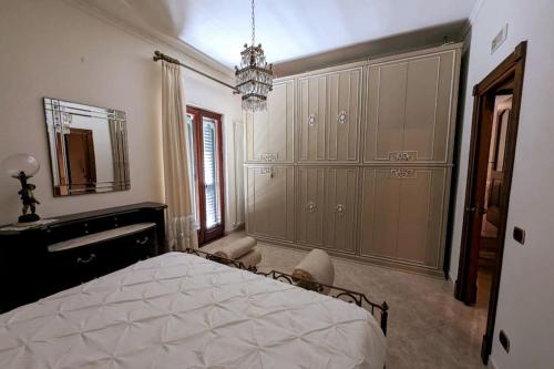 a bedroom with a bed and a dresser and a mirror at Il barocco sulla roccia in Cetara